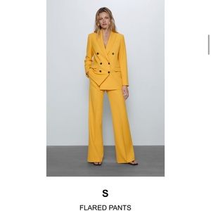 Yellow flared pants. Matches blazer